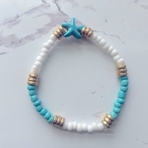 Super cute teal and gold starfish bracelet.